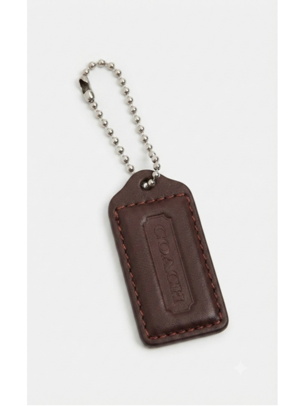 brown leather Coach hangtag bag charm
